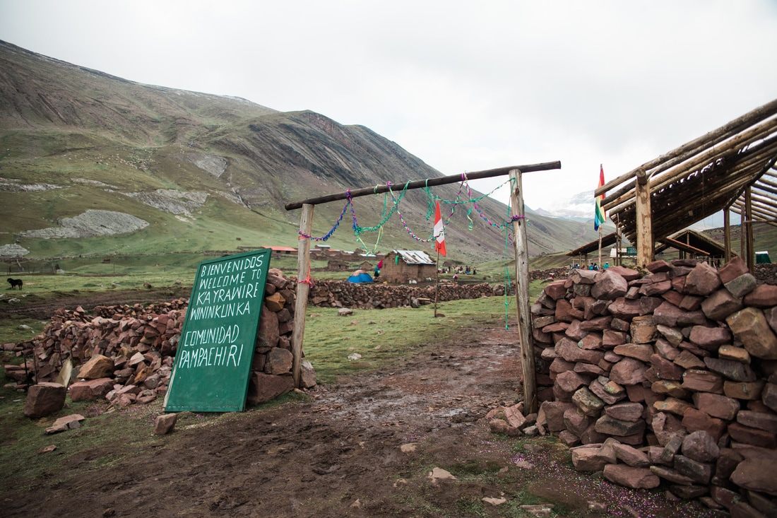 Andean village and grazing livestock along the trail to Vinicunca, Peru