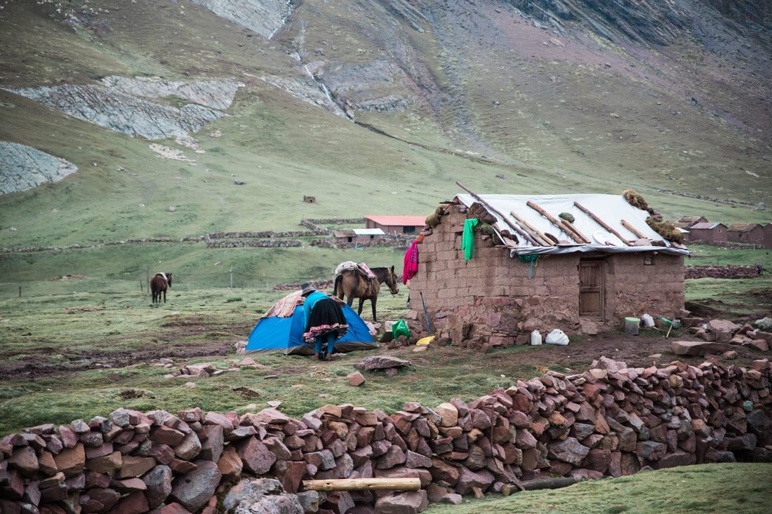 Rugged mountain trail with snow-capped peaks near Vinicunca, Peru