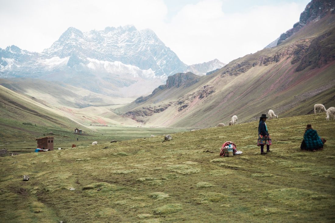Hikers walking the trail toward Rainbow Mountain in the Cusco region of Peru
