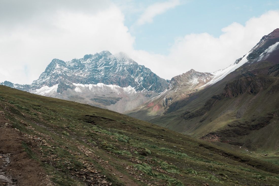 Clouds rolling over the Andes mountains near Vinicunca, Peru