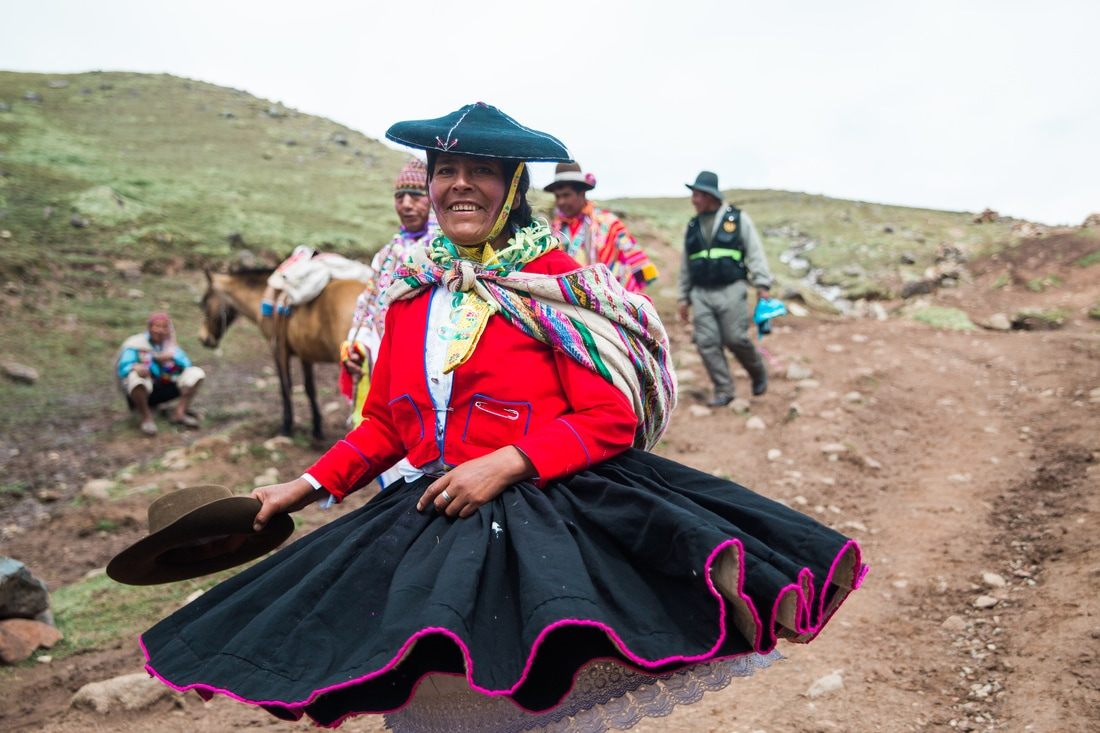 Hikers walking the trail toward Rainbow Mountain in the Cusco region of Peru
