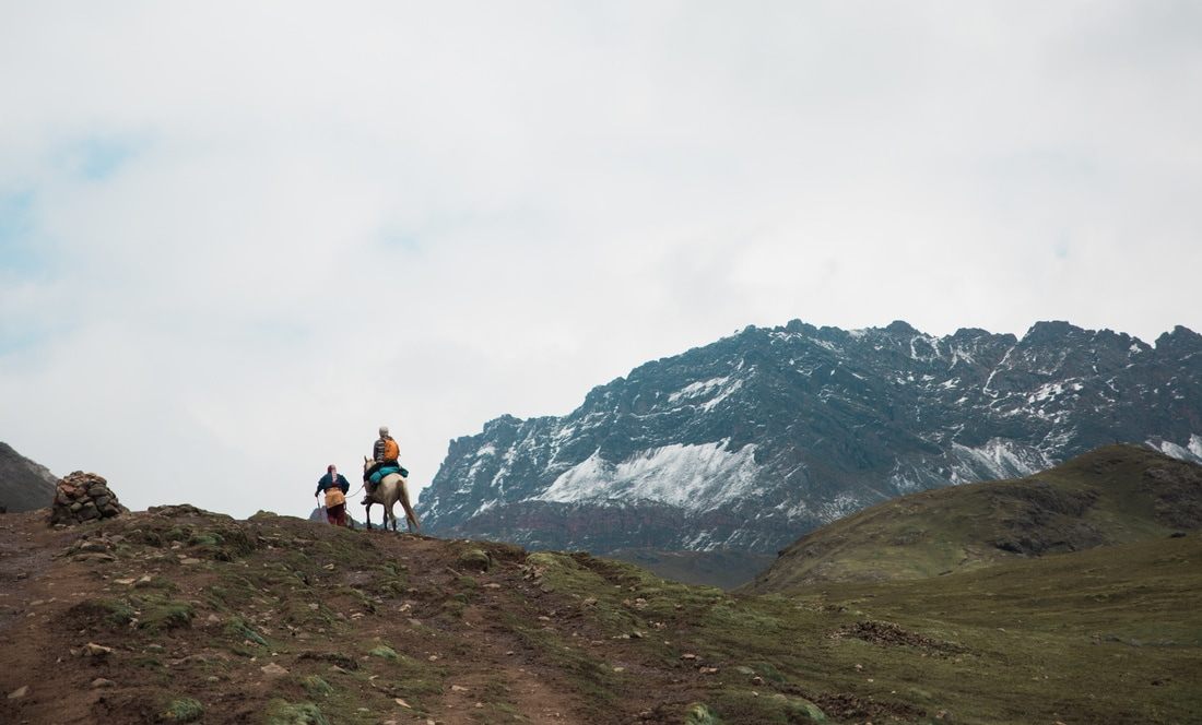 Andean village and grazing livestock along the trail to Vinicunca, Peru