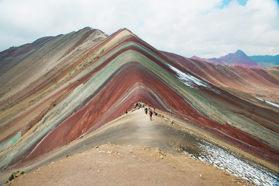 Clouds rolling over the Andes mountains near Vinicunca, Peru