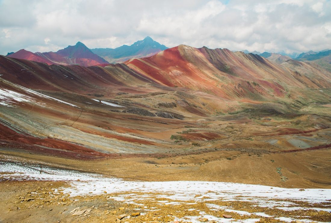 Hikers reaching the summit viewpoint of Rainbow Mountain, Peru