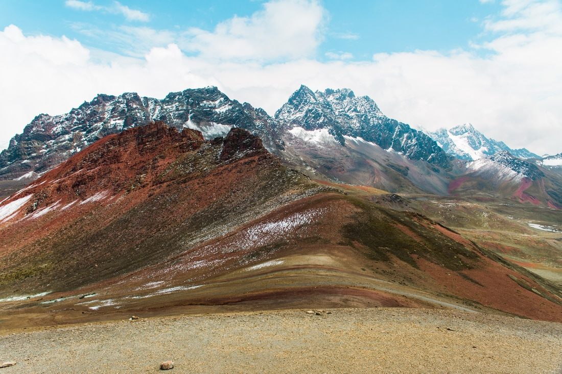Colorful striped slopes of Rainbow Mountain (Vinicunca) in the Peruvian Andes