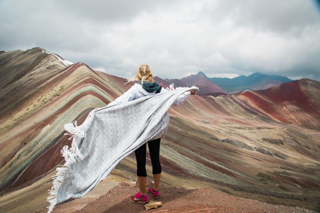 Andean village and grazing livestock along the trail to Vinicunca, Peru