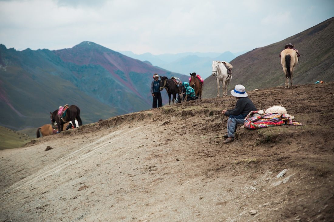 Hikers reaching the summit viewpoint of Rainbow Mountain, Peru