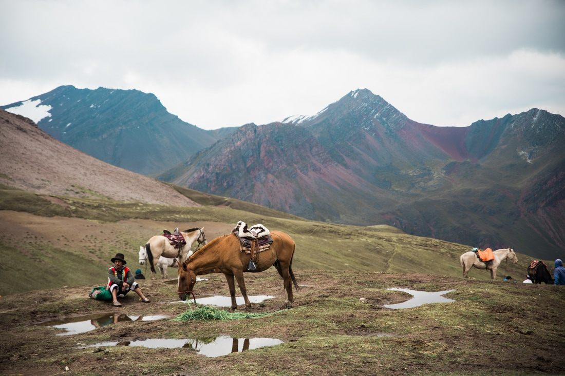 Panoramic view of the mineral-striped Rainbow Mountain range in Peru