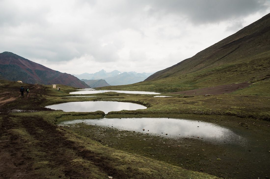 Clouds rolling over the Andes mountains near Vinicunca, Peru