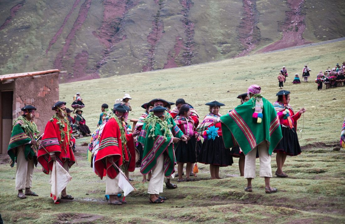 Hikers walking the trail toward Rainbow Mountain in the Cusco region of Peru