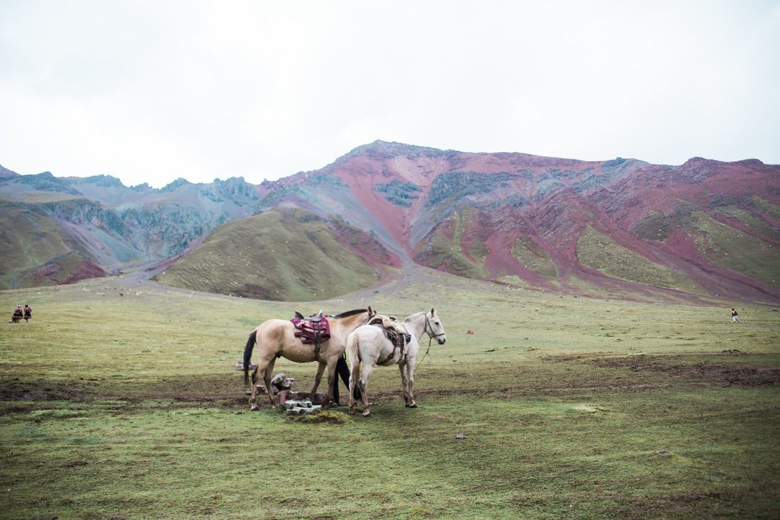 Panoramic view of the mineral-striped Rainbow Mountain range in Peru