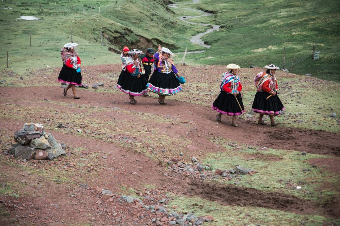 Rugged mountain trail with snow-capped peaks near Vinicunca, Peru