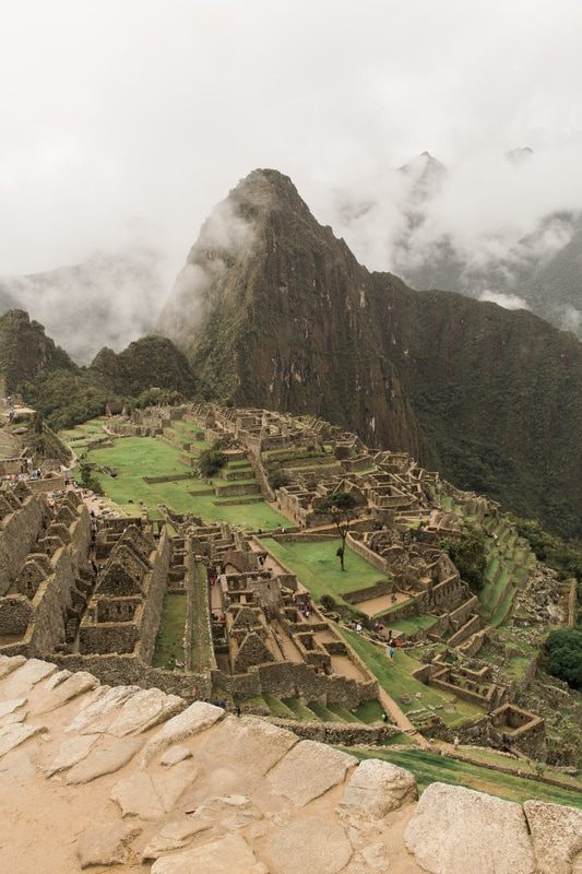 A traveler's view of the Sacred Valley from high above Machu Picchu