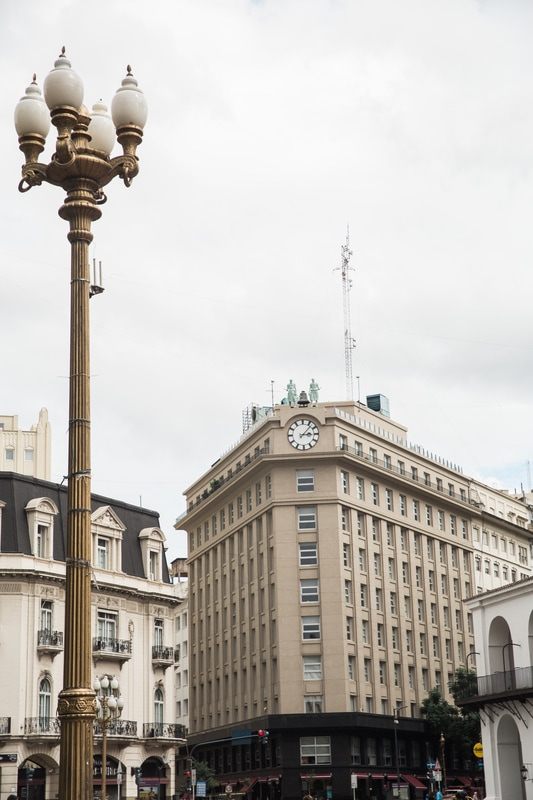 Photo of colorful colonial architecture along a city avenue in Buenos Aires, Argentina