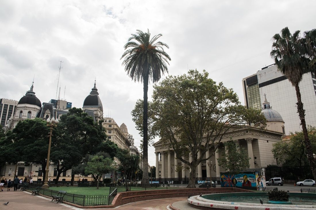 Photo of a tango dancer performing on a city sidewalk in Buenos Aires, Argentina