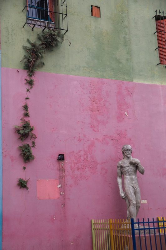 Photo of colorful colonial architecture along a city avenue in Buenos Aires, Argentina