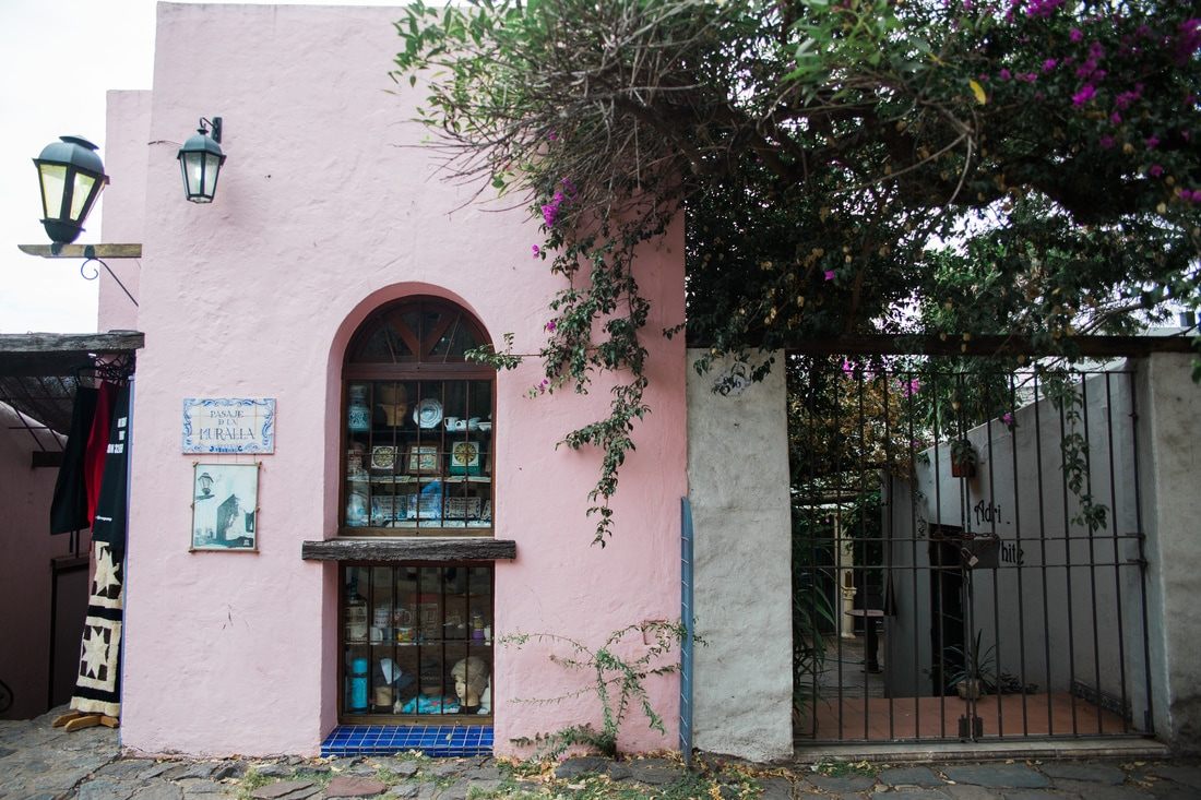 Pastel-colored buildings lining a street in Colonia, Uruguay