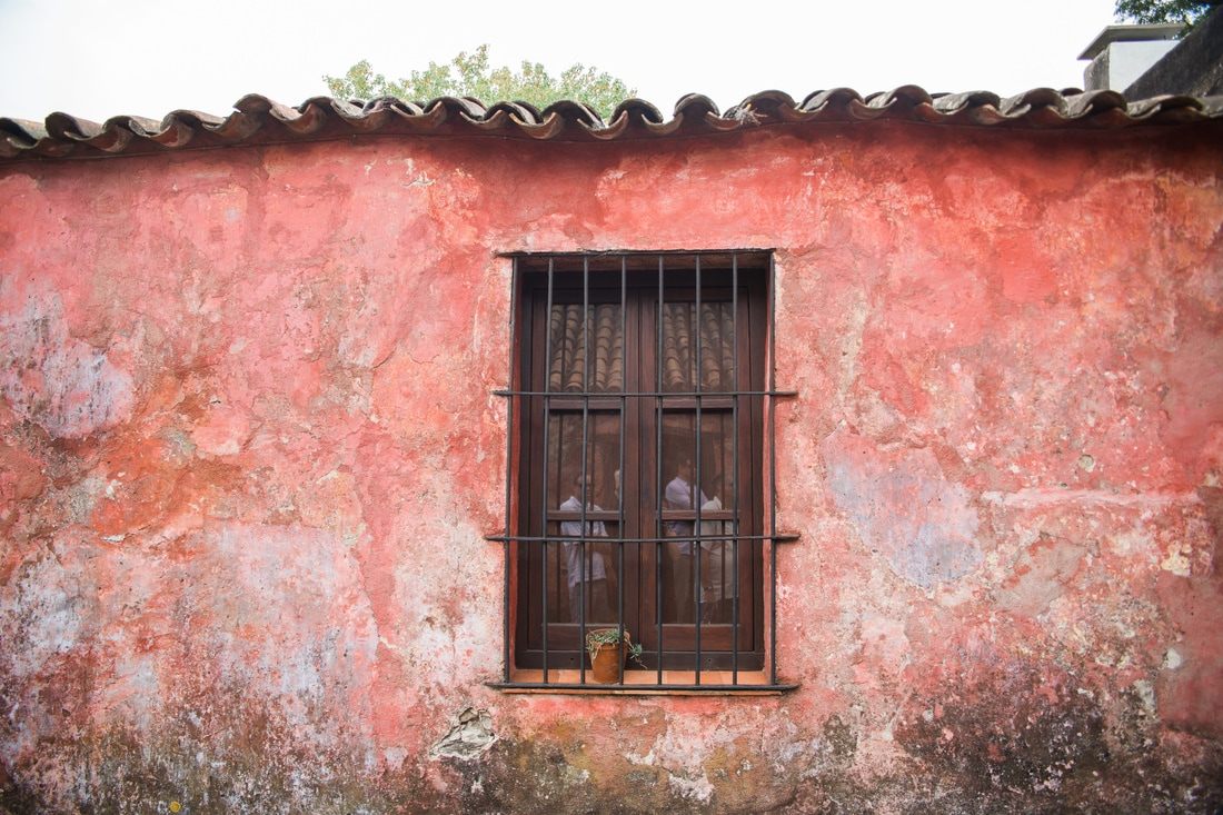 Pastel-colored buildings lining a street in Colonia, Uruguay