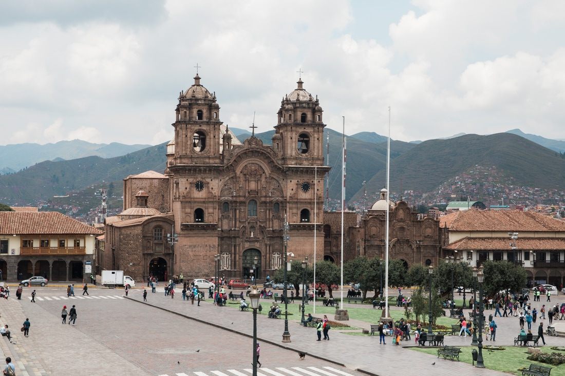 Photo of local life in a city plaza high in the Andes in Cusco, Peru