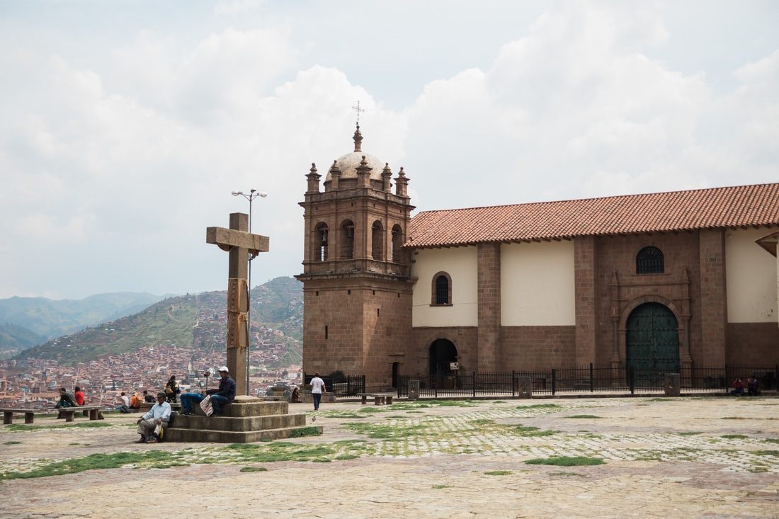 Photo of a misty mountain view above the city in Cusco, Peru