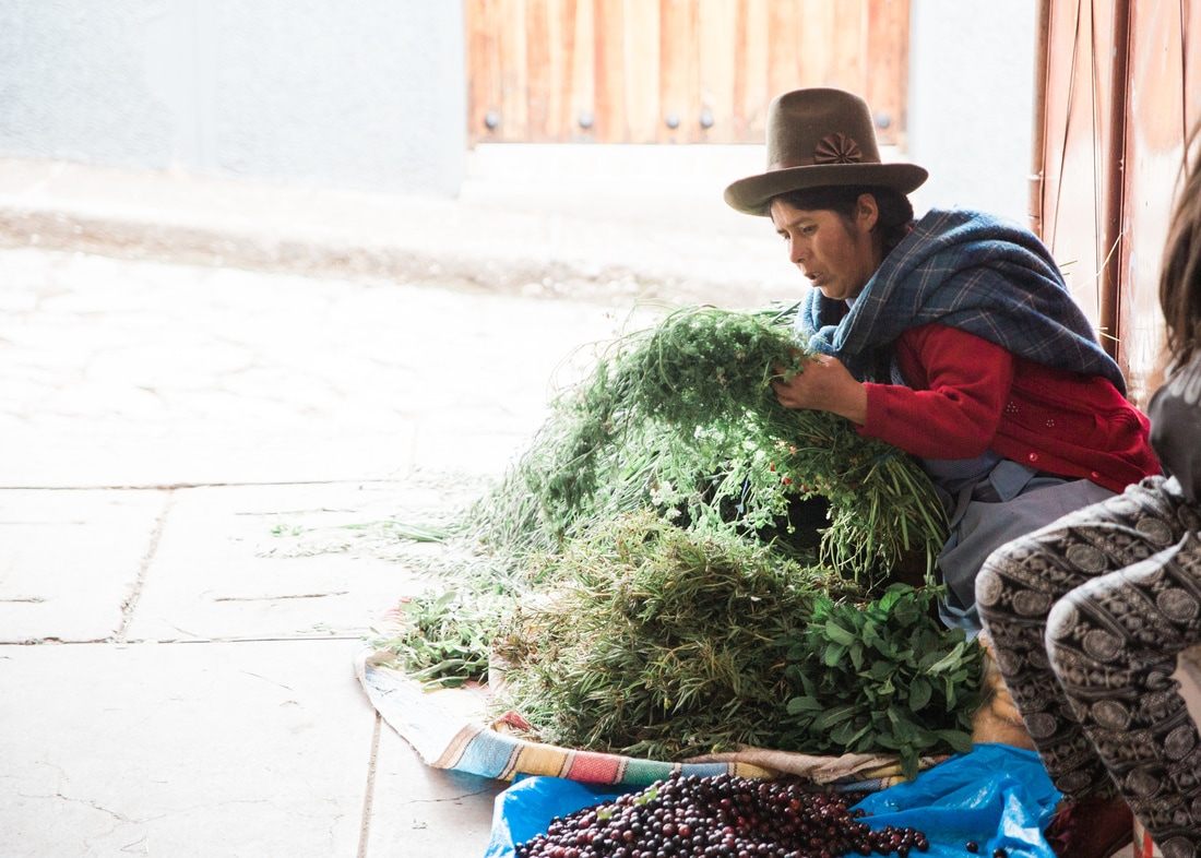 Photo of colorful textiles and market stalls in Cusco, Peru