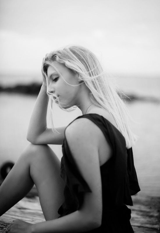 Audrey Smoak framed by beach grass and dunes at Sullivan's Island, SC