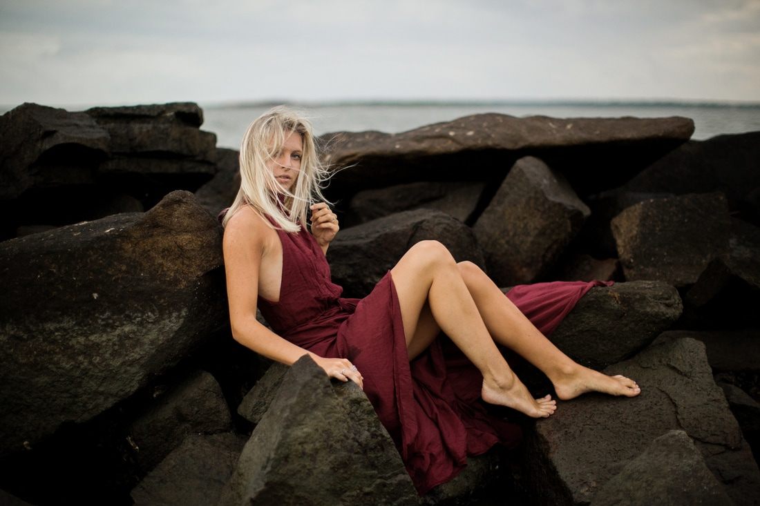 Audrey Smoak styled portrait with ocean waves rolling in behind her, another frame from the session