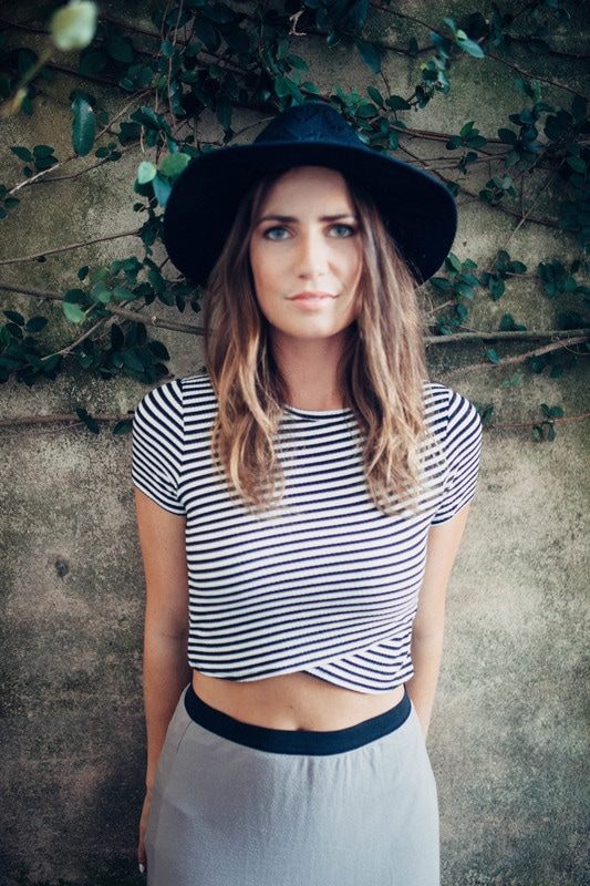 Portrait of Susan wearing a black hat during a Charleston alley photo session