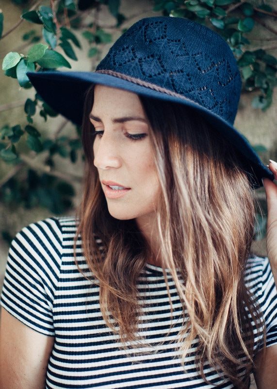 Susan strolling a historic Charleston alleyway during her portrait session