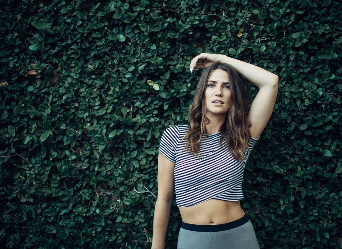 A relaxed portrait of Susan on the cobblestone streets of Charleston