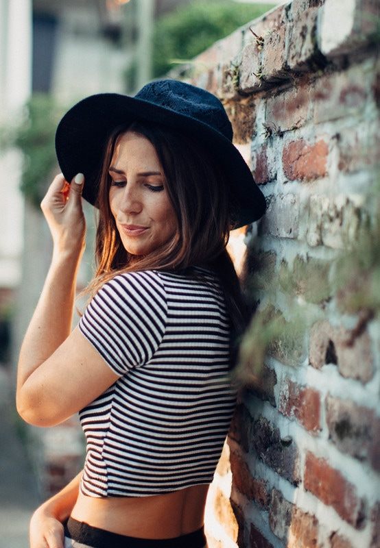 Susan strolling a historic Charleston alleyway during her portrait session