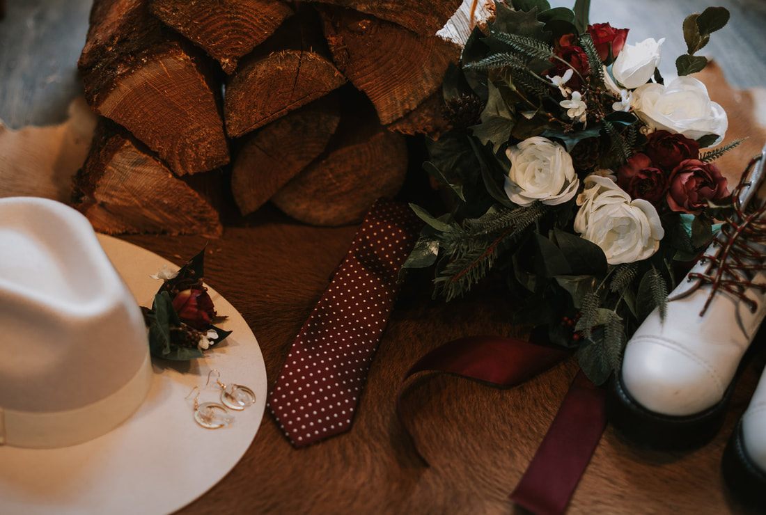 Close-up of the couple's hands during their PNW cabin elopement ceremony.