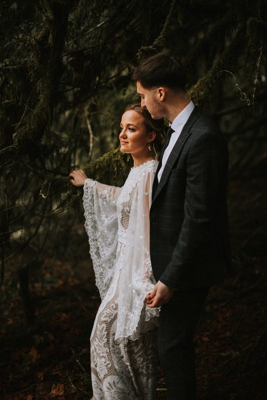 Wide shot of the cabin elopement venue surrounded by PNW forest.