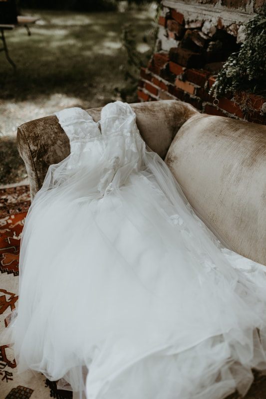 The bride and groom sharing a quiet moment in front of the Johns Island barn venue