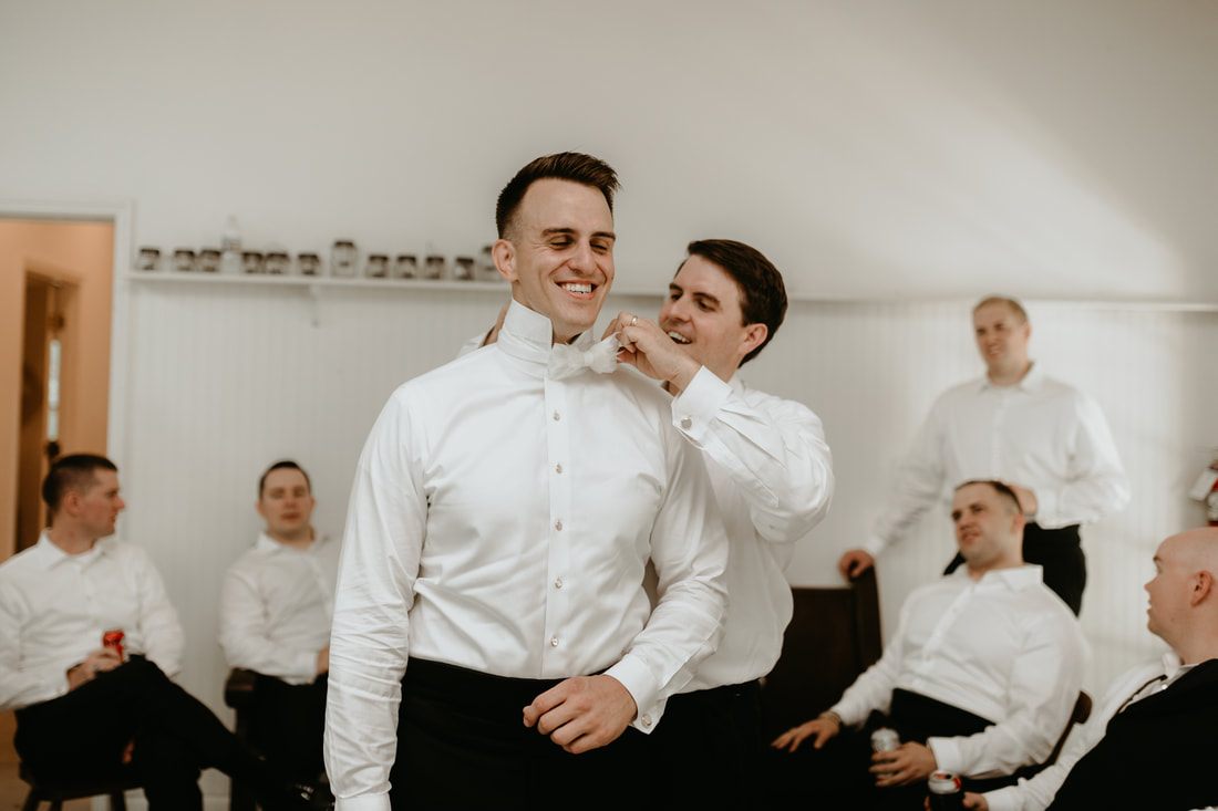 Alexis laughing together at their Charleston-area wedding celebration
