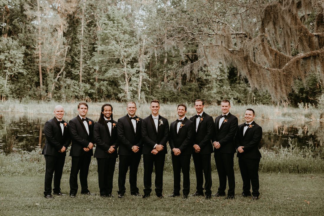 The newlyweds embracing warmly at their Charleston-area wedding celebration