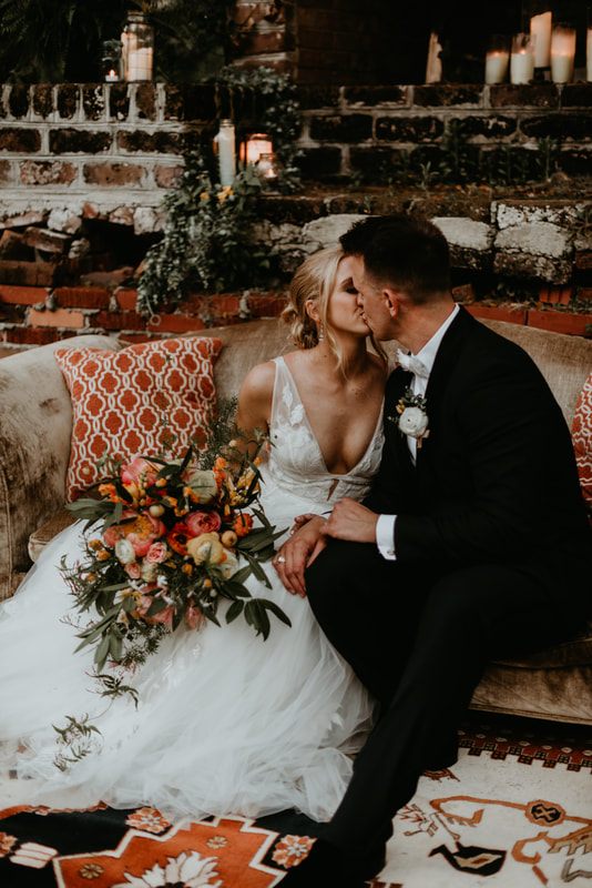 Alexis and Max sharing a quiet moment near the reception pond