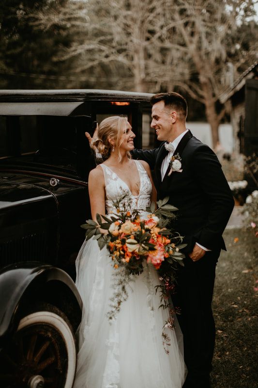 Alexis and Max celebrating with friends and family at their Charleston-area wedding celebration