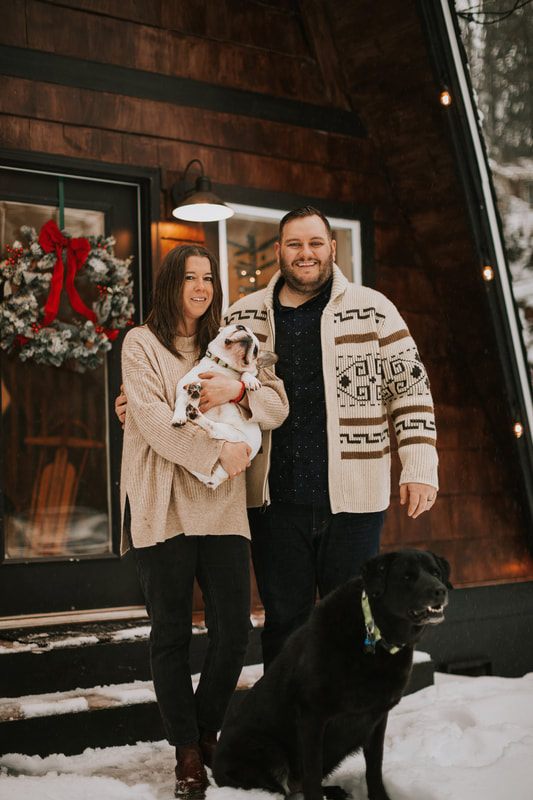 Wide shot of the family session with the snowy Cascade Mountains behind them