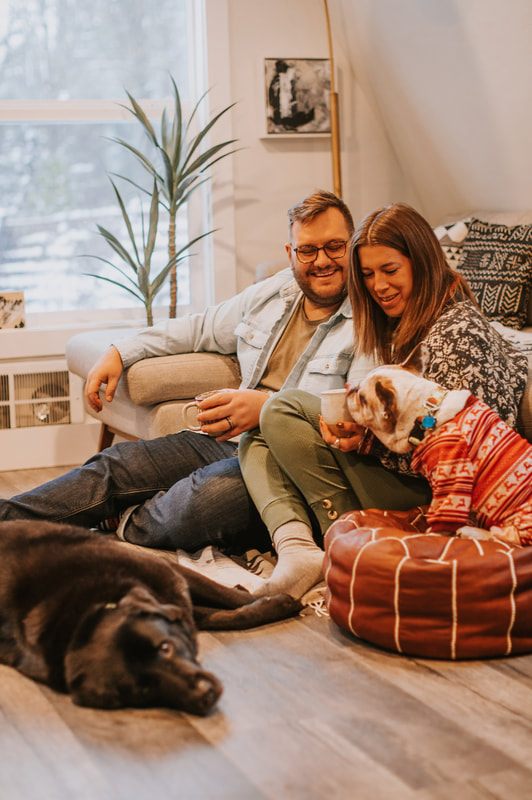 Family portrait of Ryan, Lyndsey, and their two dogs at the PNW cabin