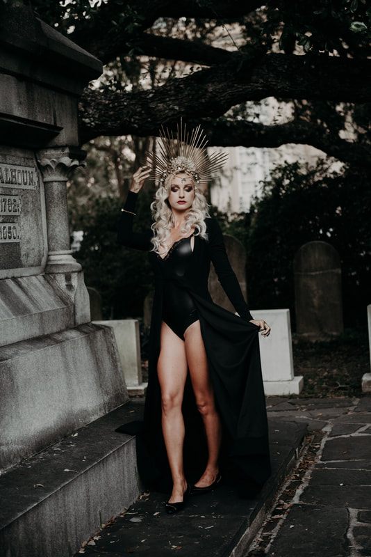 Close-up portrait with dramatic Halloween-inspired hair and headpiece styling