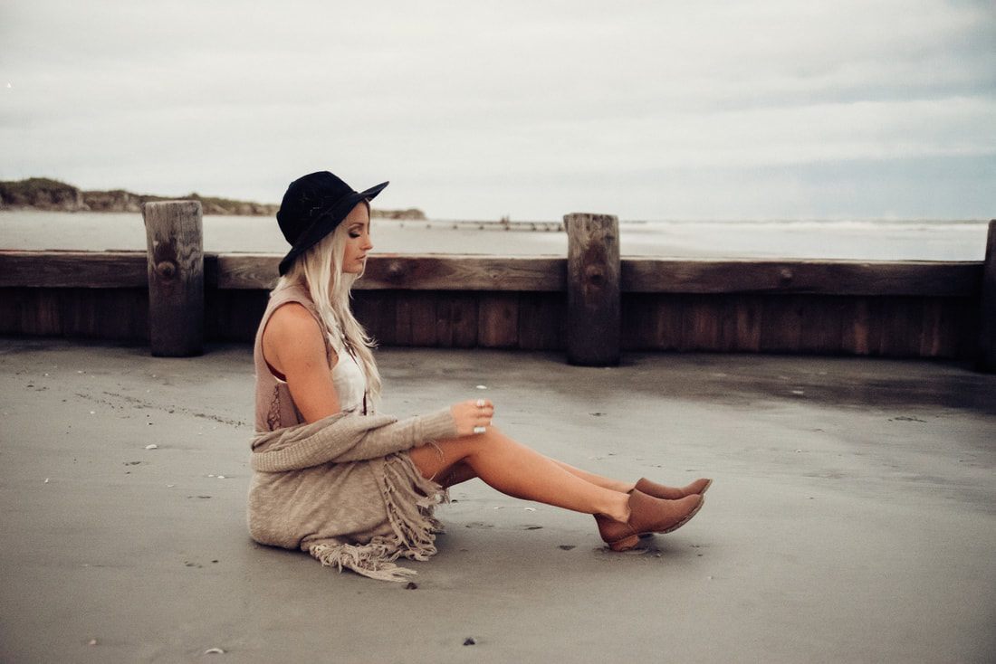 Candid friendship portrait on Folly Beach, South Carolina