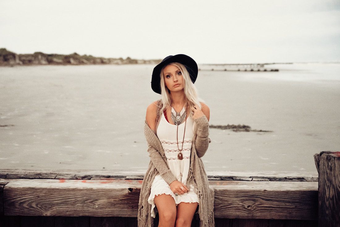 Portrait session on the sand at Folly Beach at sunset