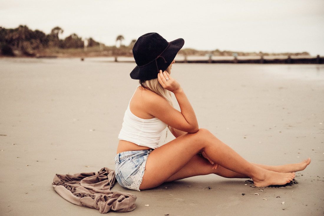 Two best friends posing together on Folly Beach, South Carolina
