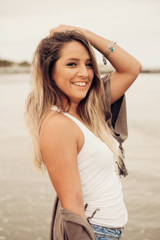 Portrait session on the sand at Folly Beach at sunset