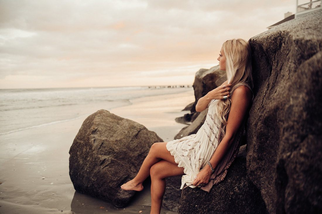 Portrait session on the sand at Folly Beach at sunset