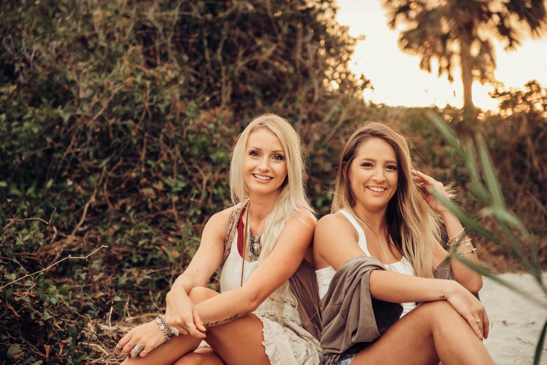 Portrait session on the sand at Folly Beach at sunset