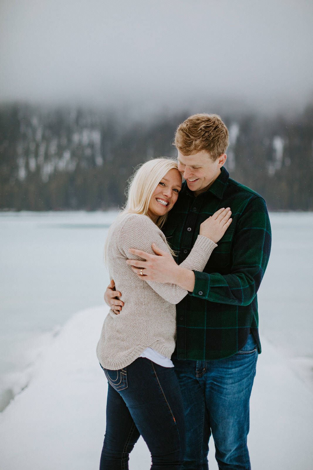 Couple sharing a quiet moment on the porch of their PNW cabin
