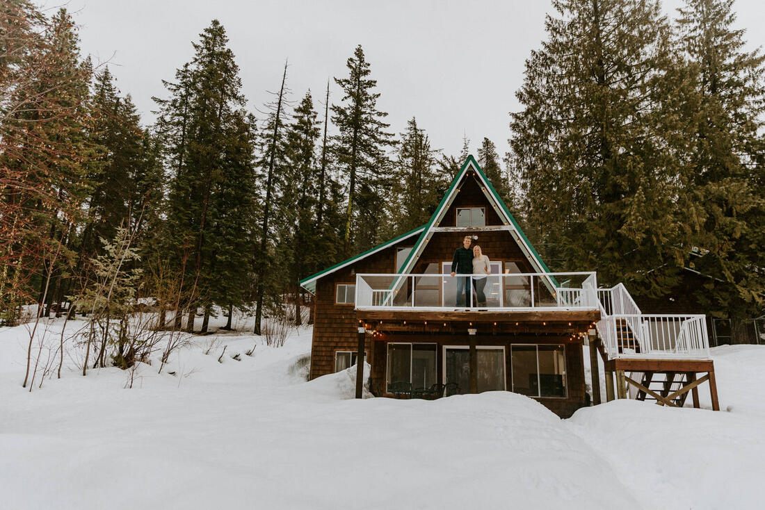 Couple embracing outdoors near their PNW cabin retreat