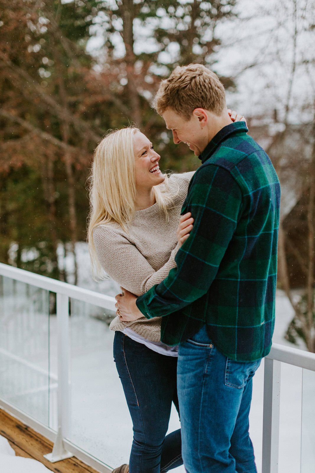 Couple sitting together on cabin steps in Washington's Cascade foothills